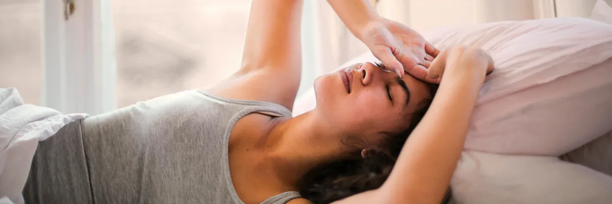 ahb_bodywork-contraindications-existing-health-conditions Woman on bed, relaxed, illustrating trust in confidence in our medically proven bodywork therapies