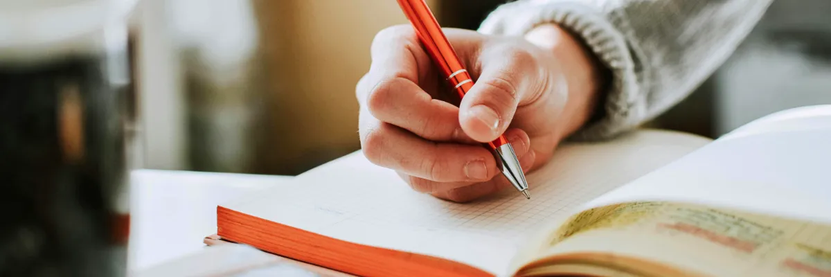 ahb_bodywork-testimonials-reviews-trusted-therapies-somatic Womans hand writing testimonial or review for our trusted bodywork somatic healing treatments and therapies